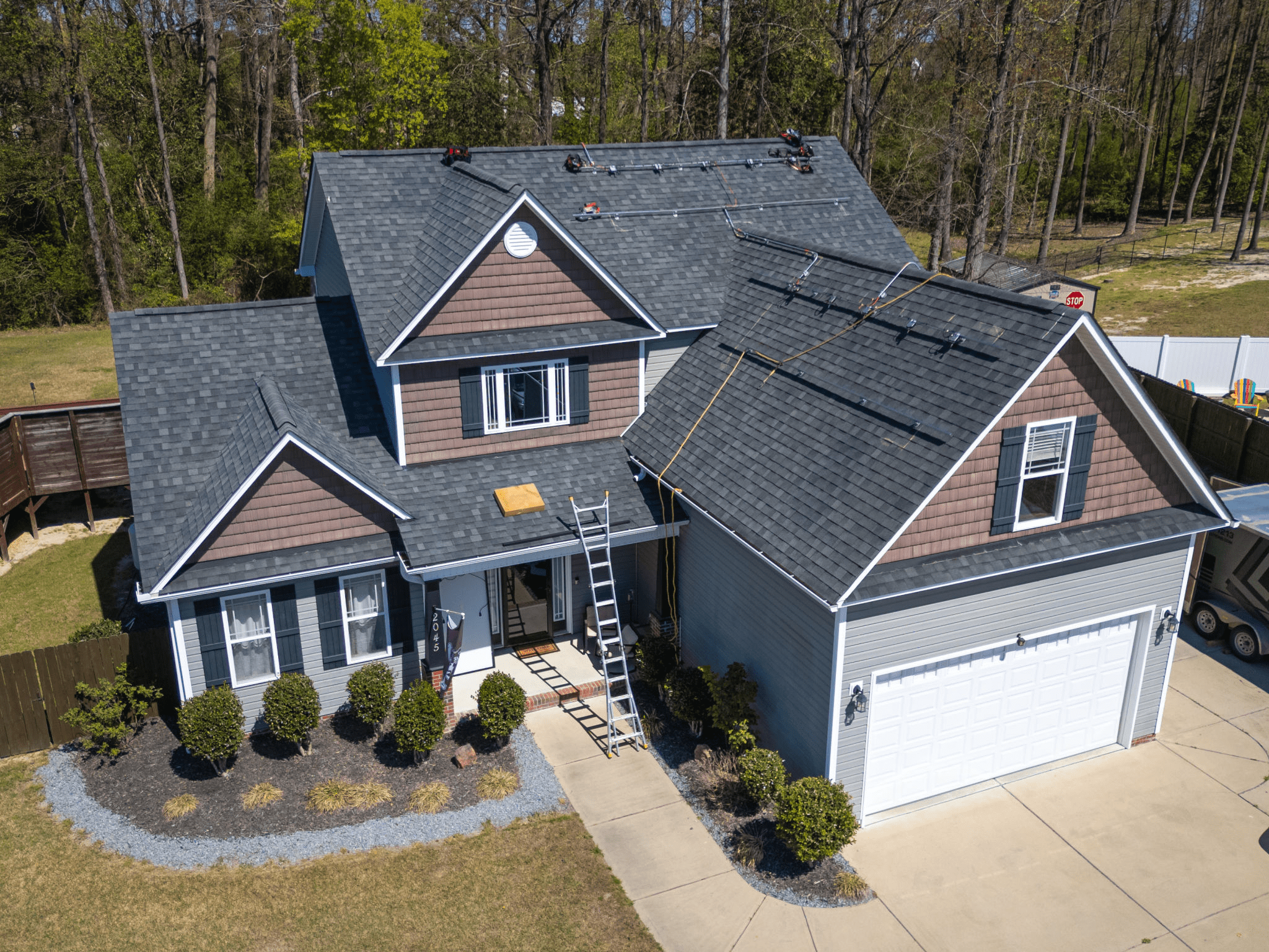 Two-story house with garage and trees