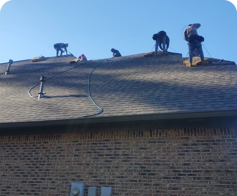 Construction team working on house roof